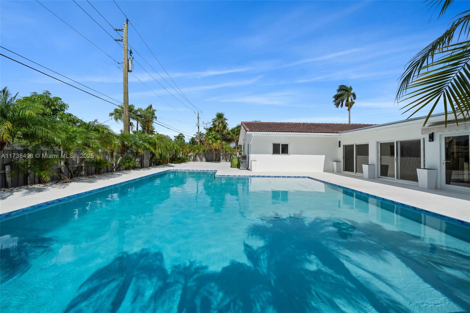 1144 Adams Street Hollywood, FL 33019 - Photo 47 of 51 a view of a house with a swimming pool