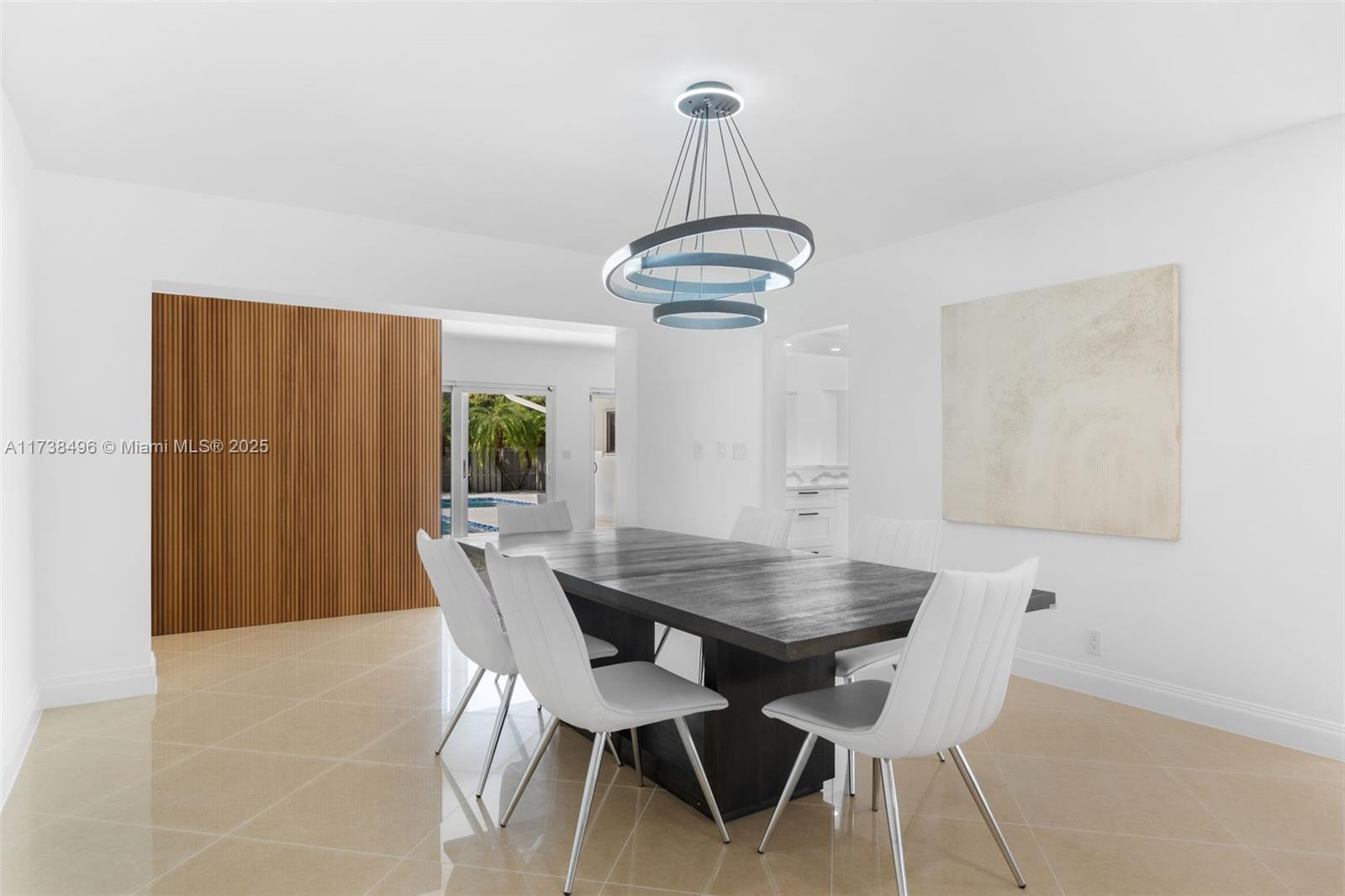 1144 Adams Street Hollywood, FL 33019 - Photo 6 of 51 a view of a dining room with a table and chairs