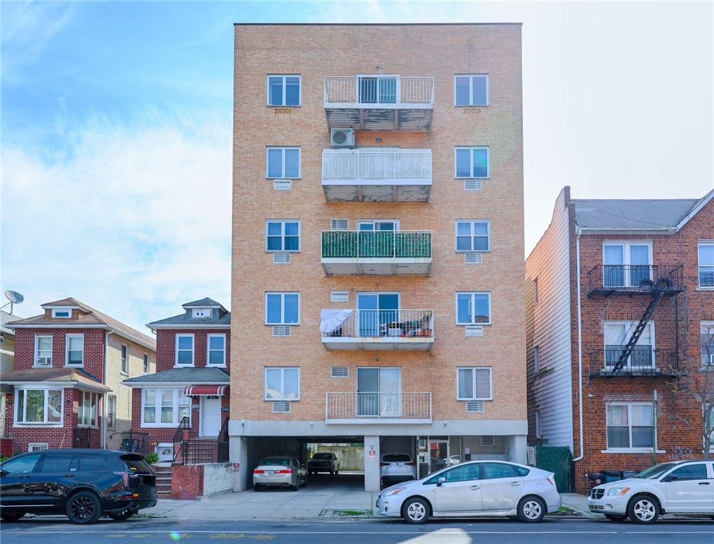 1663 West 6th Street, Unit 3B Brooklyn, NY 11223 - Photo 1 of 16 a front view of a building with lot of cars and trees