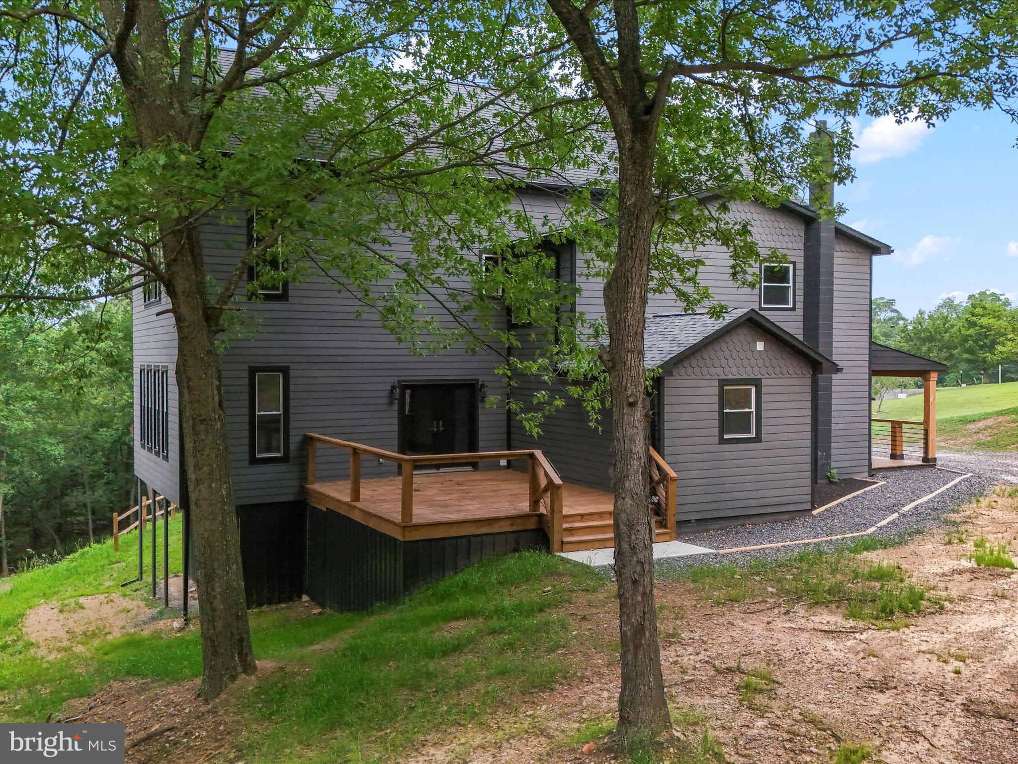 783 Community Way Road Romney, WV 26757 - Photo 12 of 83 a view of backyard of house and trees