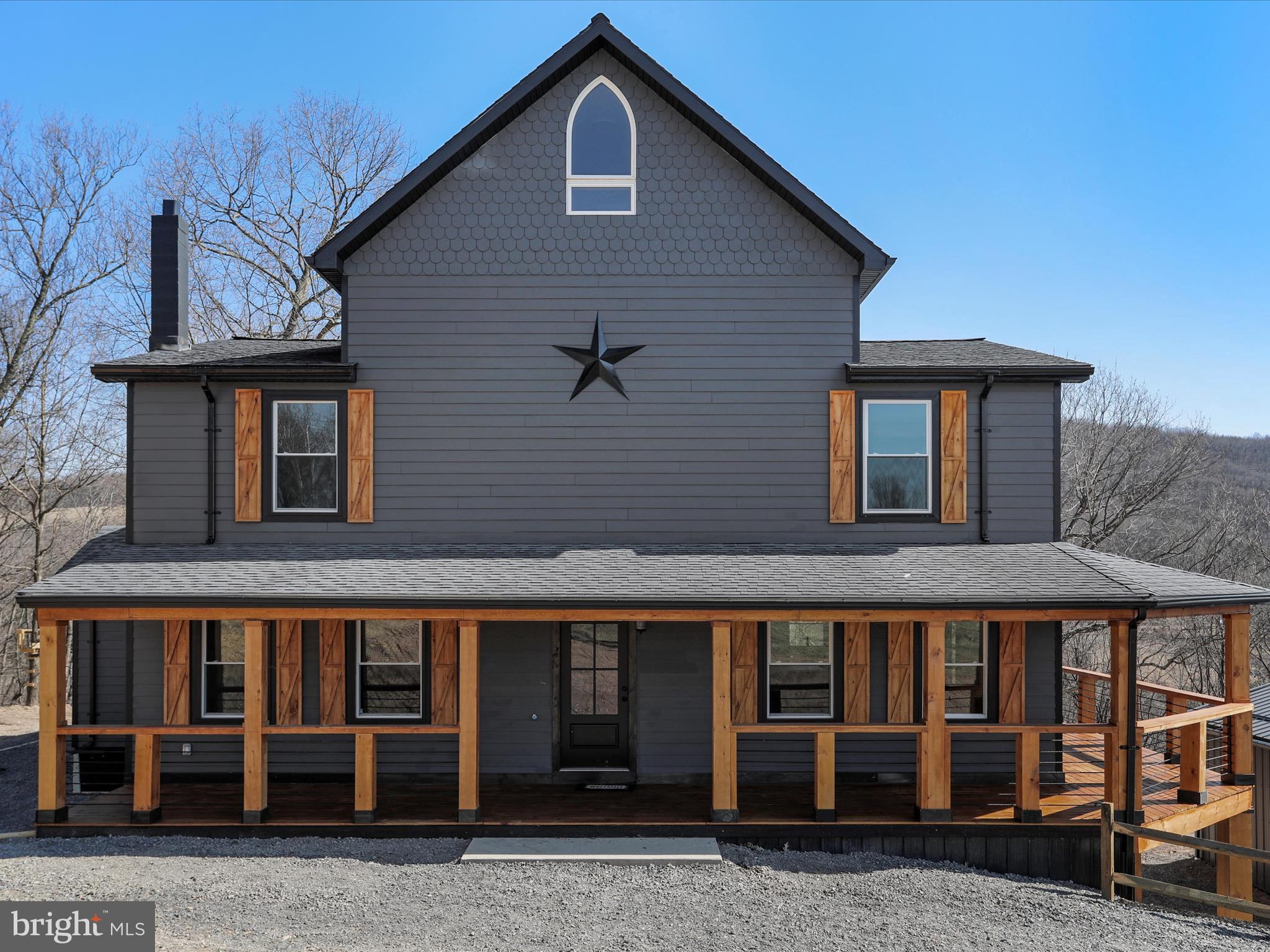 783 Community Way Road Romney, WV 26757 - Photo 13 of 83 a front view of a house with glass windows