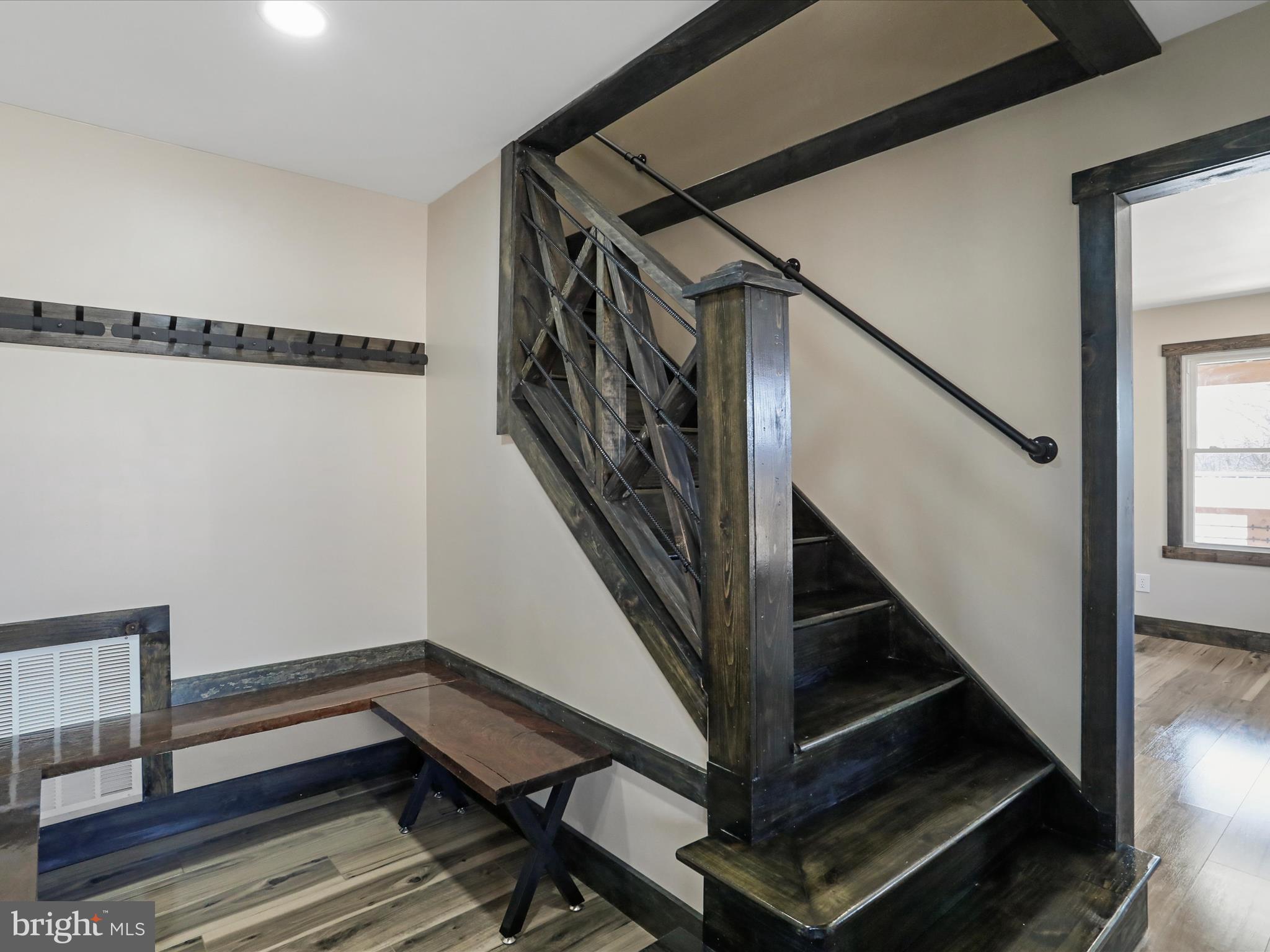 783 Community Way Road Romney, WV 26757 - Photo 17 of 83 a view of entryway with wooden floor and stairs