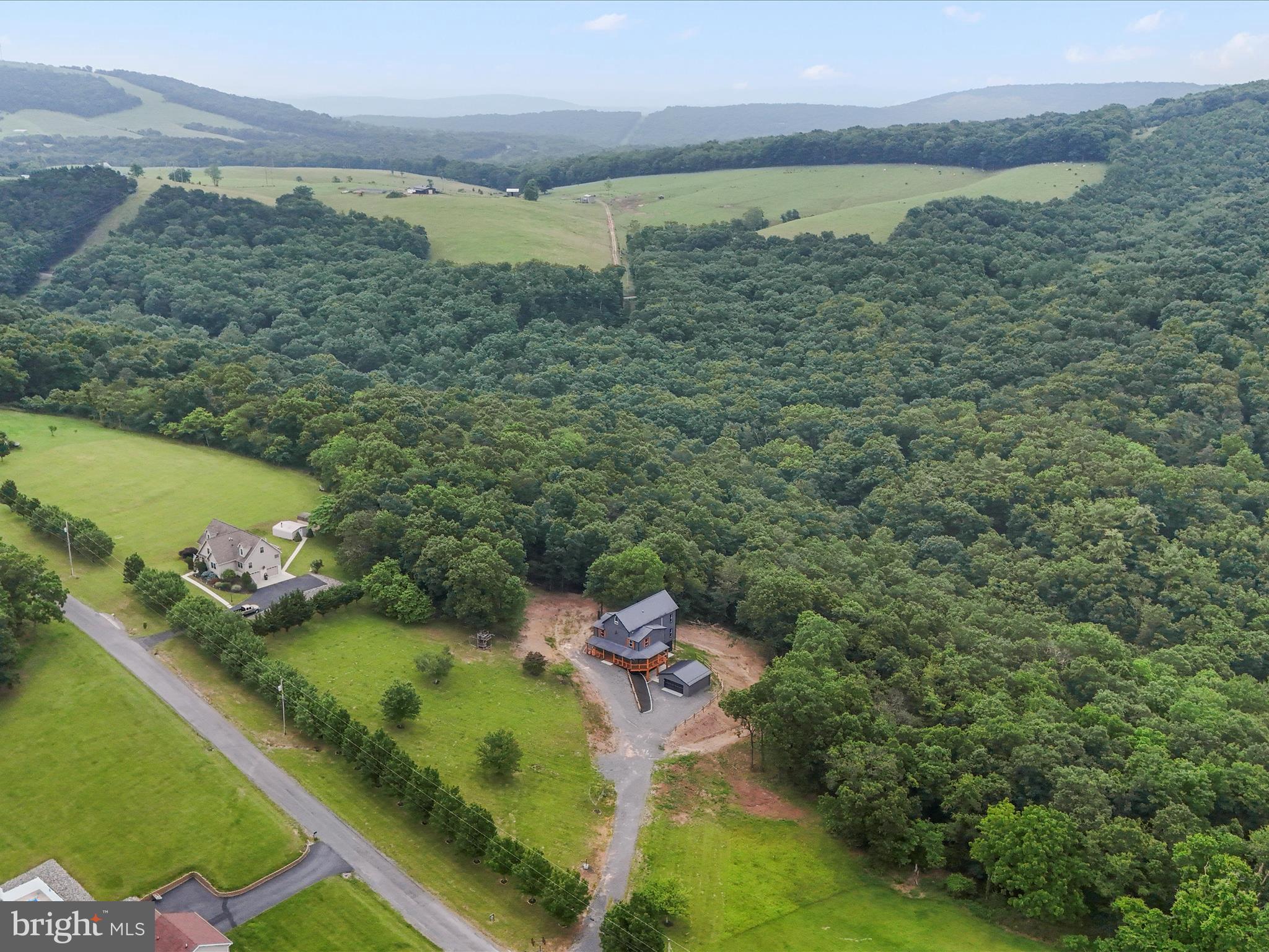 783 Community Way Road Romney, WV 26757 - Photo 6 of 83 a view of a lake with a mountain