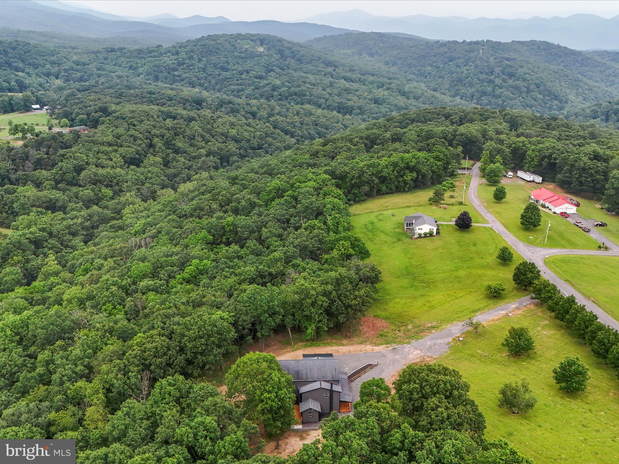783 Community Way Road Romney, WV 26757 - Photo 80 of 83 an aerial view of residential houses with outdoor space and trees