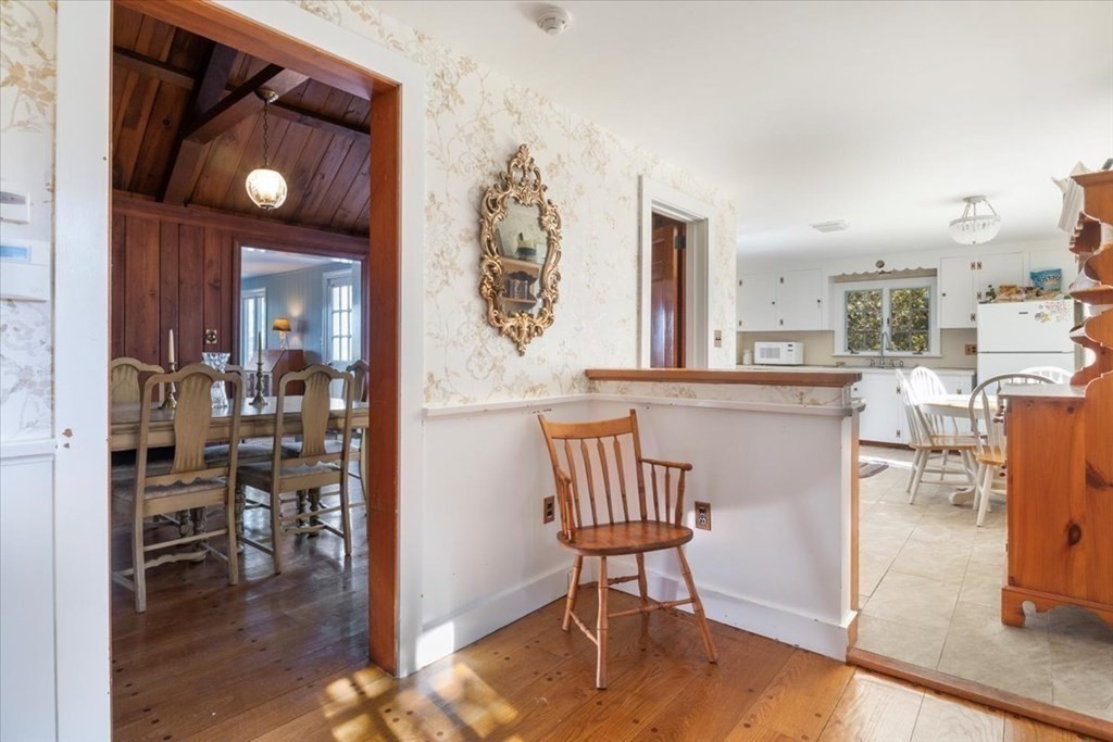 157 Daniels Island Road Mashpee, MA 02649 - Photo 11 of 41 a view of a dining room with furniture and wooden floor