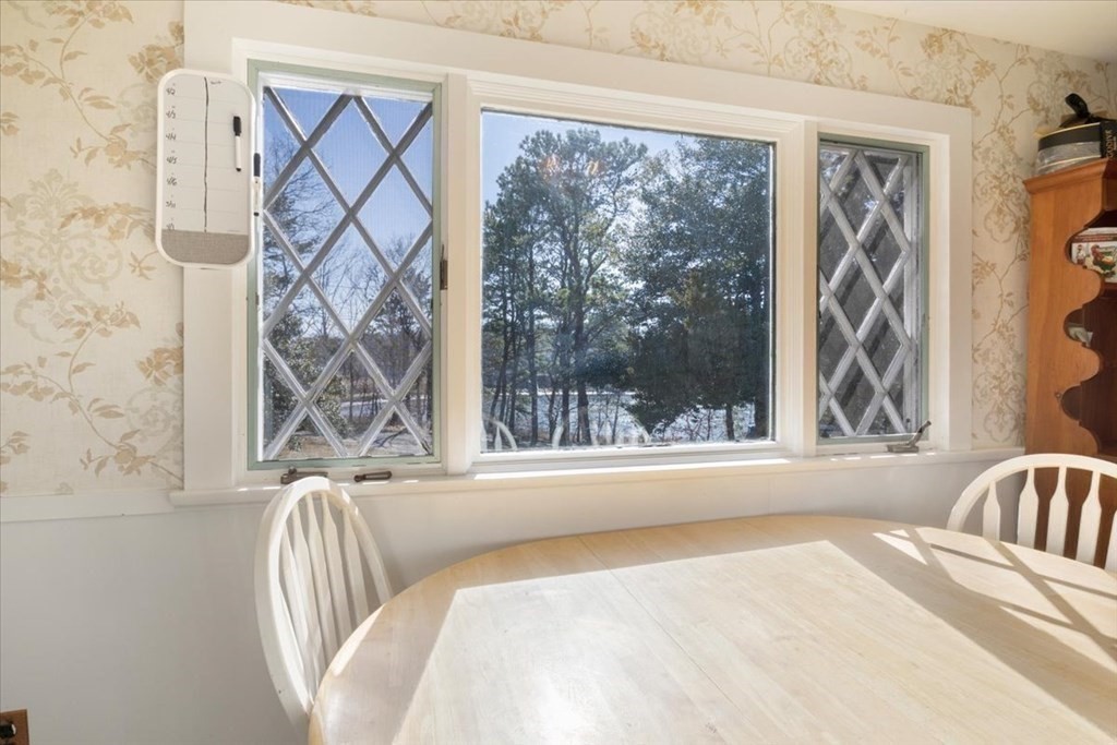157 Daniels Island Road Mashpee, MA 02649 - Photo 12 of 41 a view of a bedroom with a bed and a window