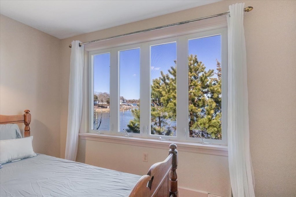 157 Daniels Island Road Mashpee, MA 02649 - Photo 19 of 41 a bedroom with a bed and a window