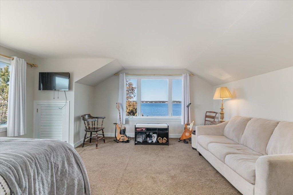 157 Daniels Island Road Mashpee, MA 02649 - Photo 20 of 41 a bed room with furniture and a fireplace