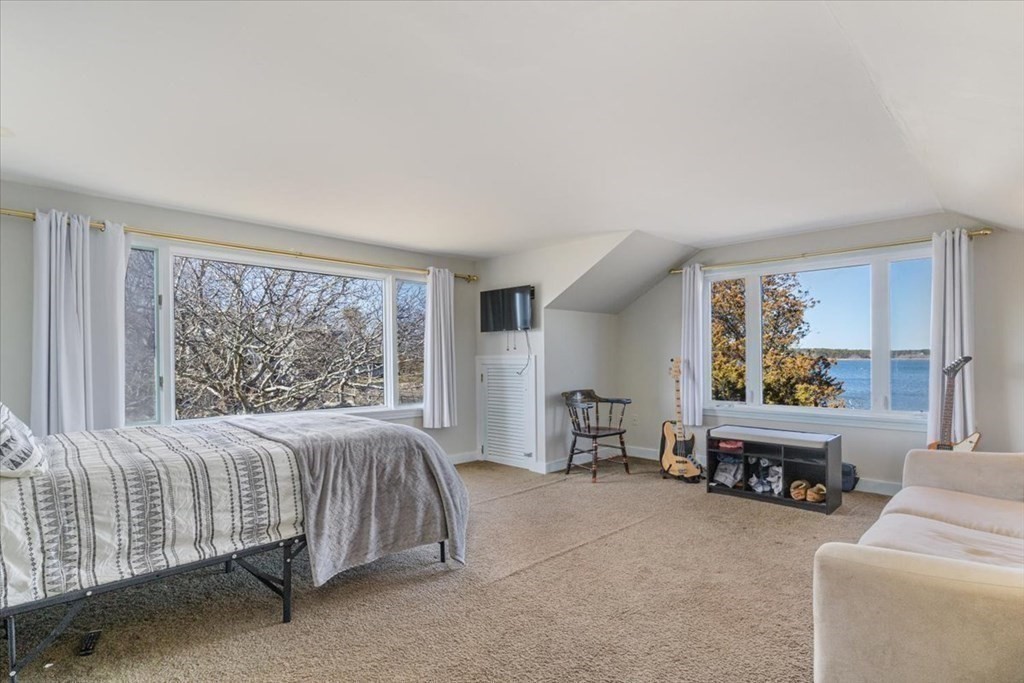 157 Daniels Island Road Mashpee, MA 02649 - Photo 22 of 41 a bed room with a bed and a chair