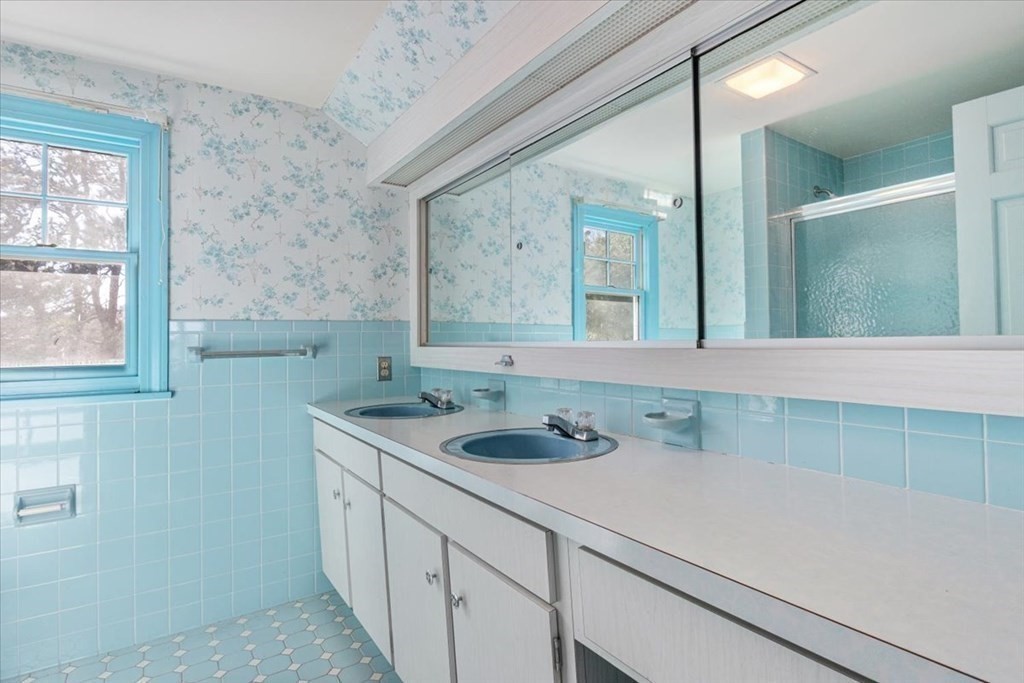 157 Daniels Island Road Mashpee, MA 02649 - Photo 23 of 41 a bathroom with a sink and a mirror