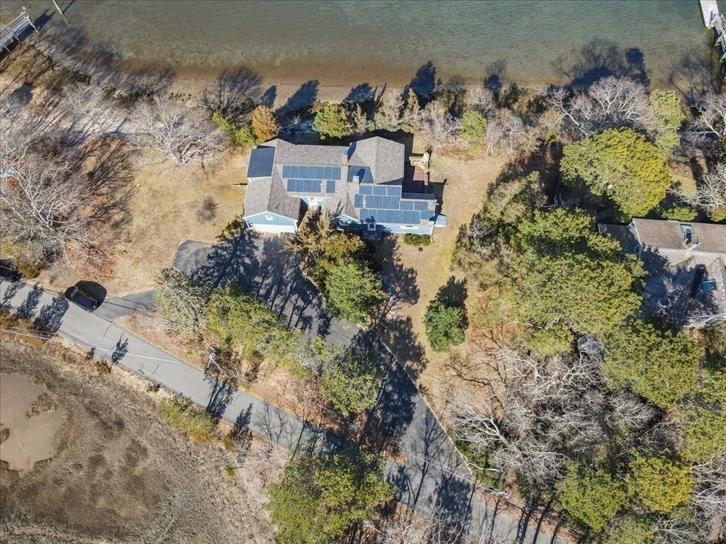 157 Daniels Island Road Mashpee, MA 02649 - Photo 26 of 41 a view of a houses with a yard