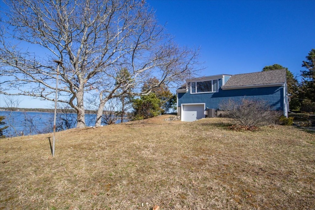 157 Daniels Island Road Mashpee, MA 02649 - Photo 35 of 41 a view of a house with a yard
