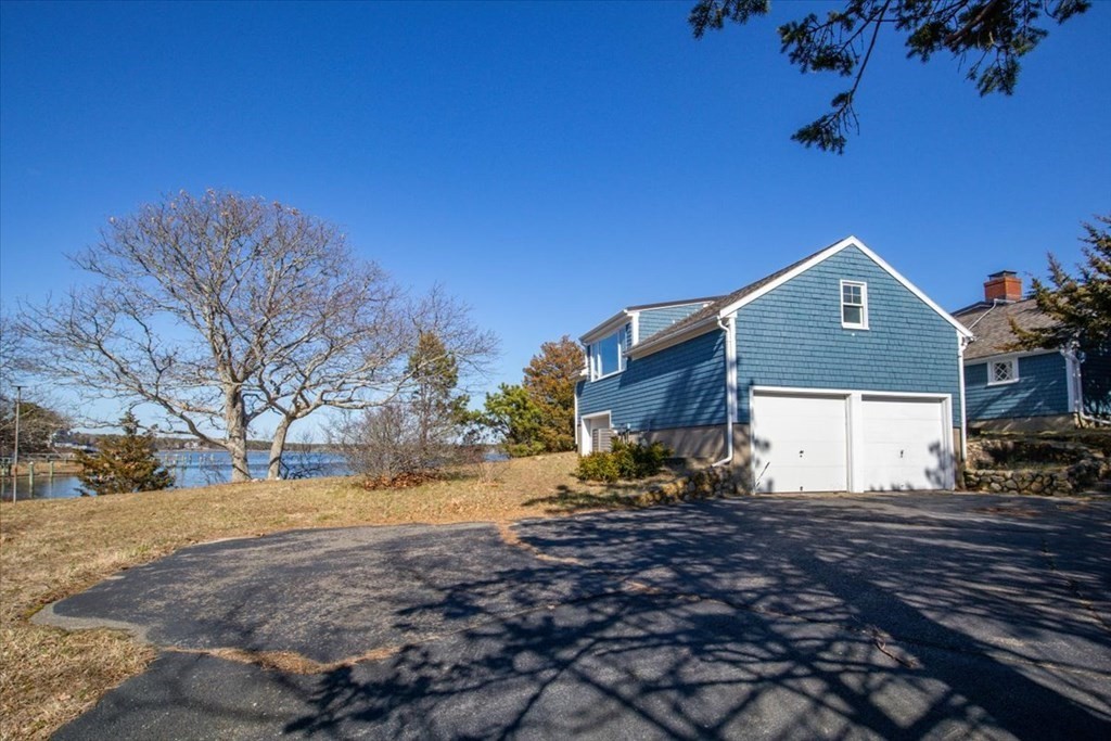 157 Daniels Island Road Mashpee, MA 02649 - Photo 37 of 41 a front view of a house with a yard