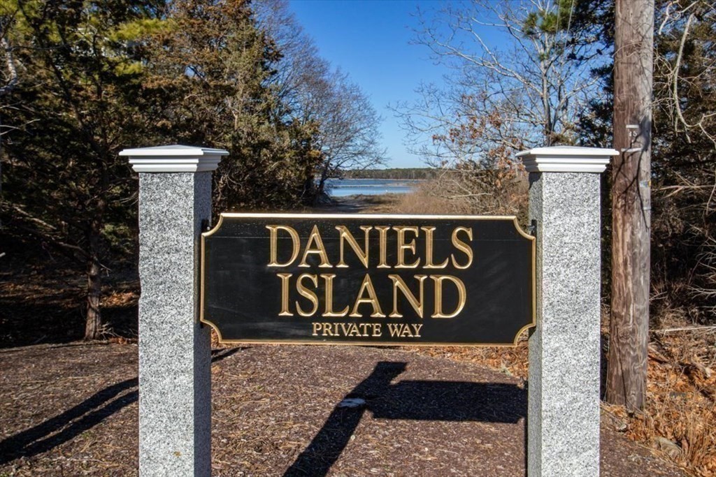 157 Daniels Island Road Mashpee, MA 02649 - Photo 10 of 41 a sign broad on the side of a road