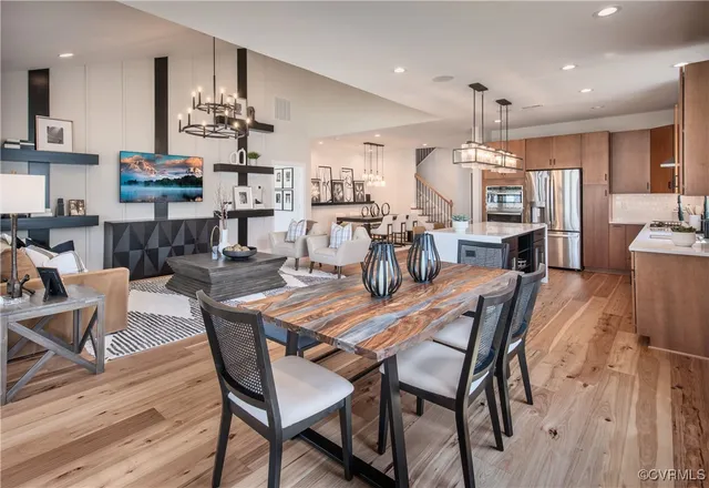 a dining room with furniture and wooden floor