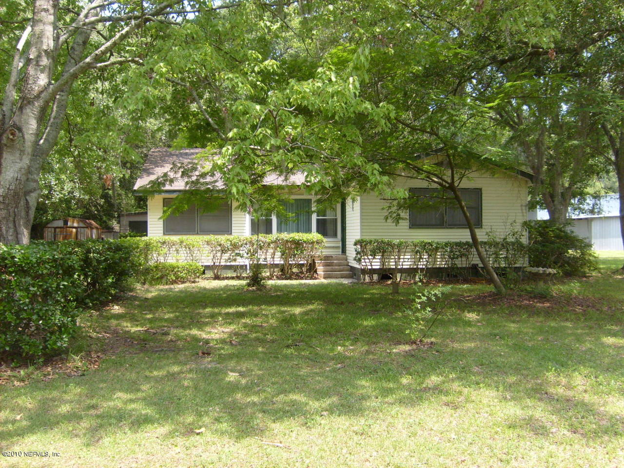 12975 Yellow Bluff Road Jacksonville, FL 32226 - Photo 1 of 5 a front view of a house with a garden