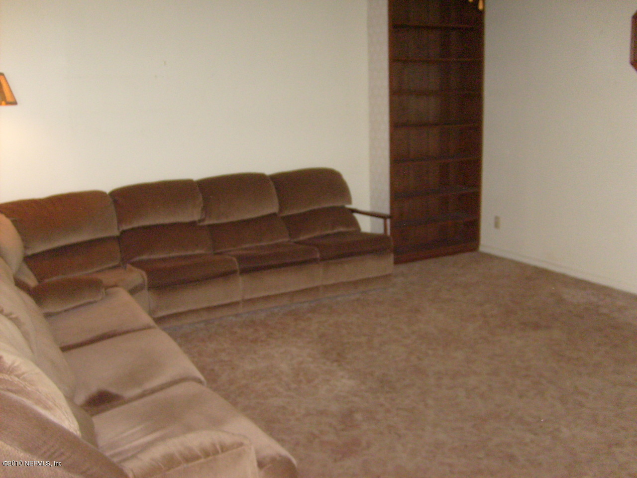 12975 Yellow Bluff Road Jacksonville, FL 32226 - Photo 4 of 5 a living room with furniture and walk in closet