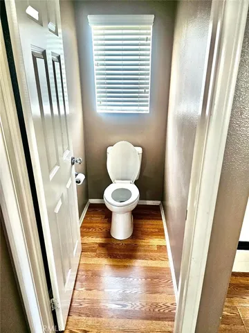 a bathroom with a toilet and a sink view
