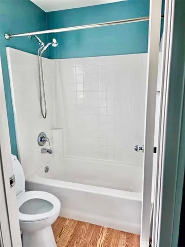 a bathroom with a shower and a toilet