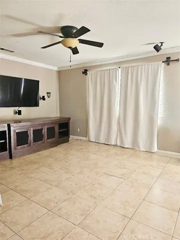 a view of a livingroom with furniture and flat screen tv