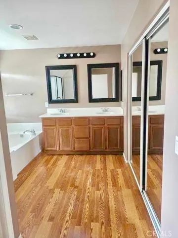 a view of a kitchen with stainless steel appliances granite countertop a refrigerator and a sink