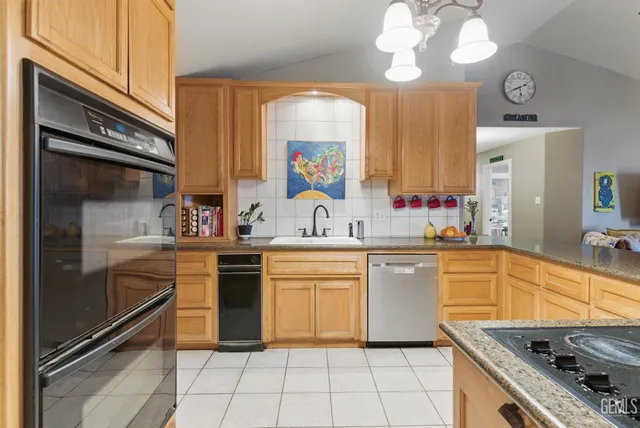 a kitchen with cabinets and window