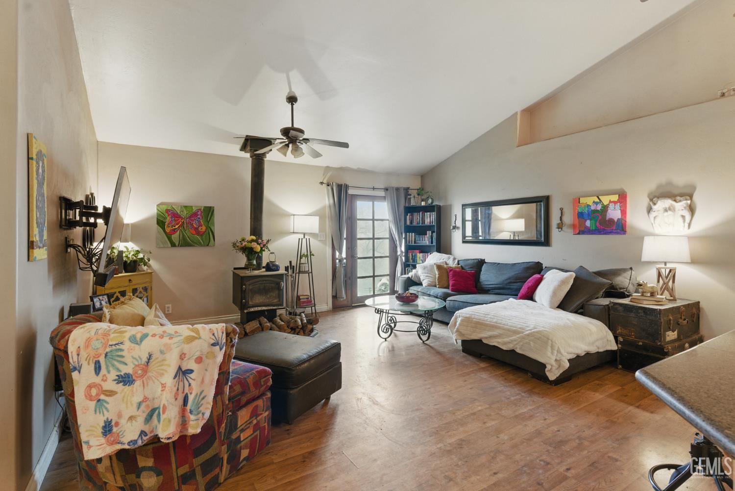 Undisclosed Address Tehachapi, CA 93561 - Photo 22 of 40 a bedroom with bed and a chandelier