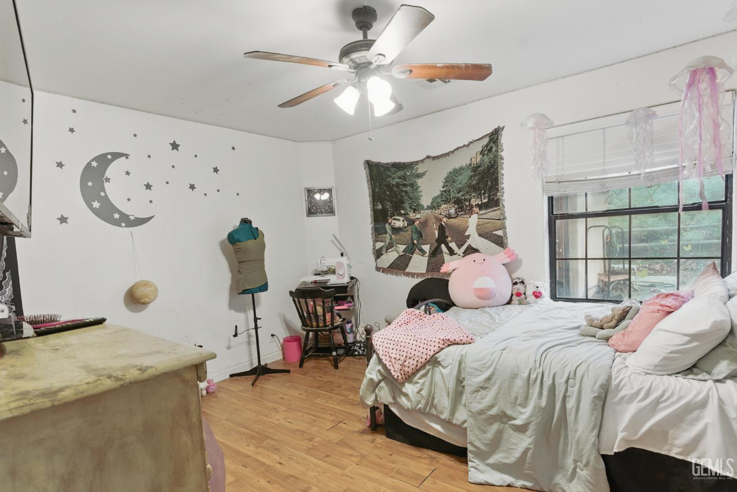 Undisclosed Address Tehachapi, CA 93561 - Photo 25 of 40 a bedroom with a bed and a chandelier