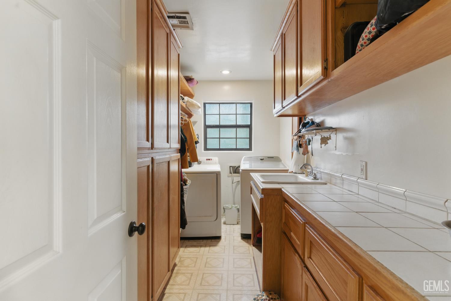 Undisclosed Address Tehachapi, CA 93561 - Photo 32 of 40 a kitchen with a refrigerator and a sink