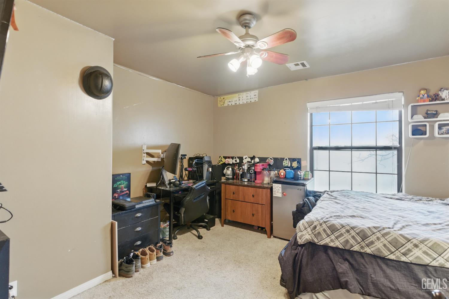 Undisclosed Address Tehachapi, CA 93561 - Photo 33 of 40 a bedroom with a bed and a chandelier