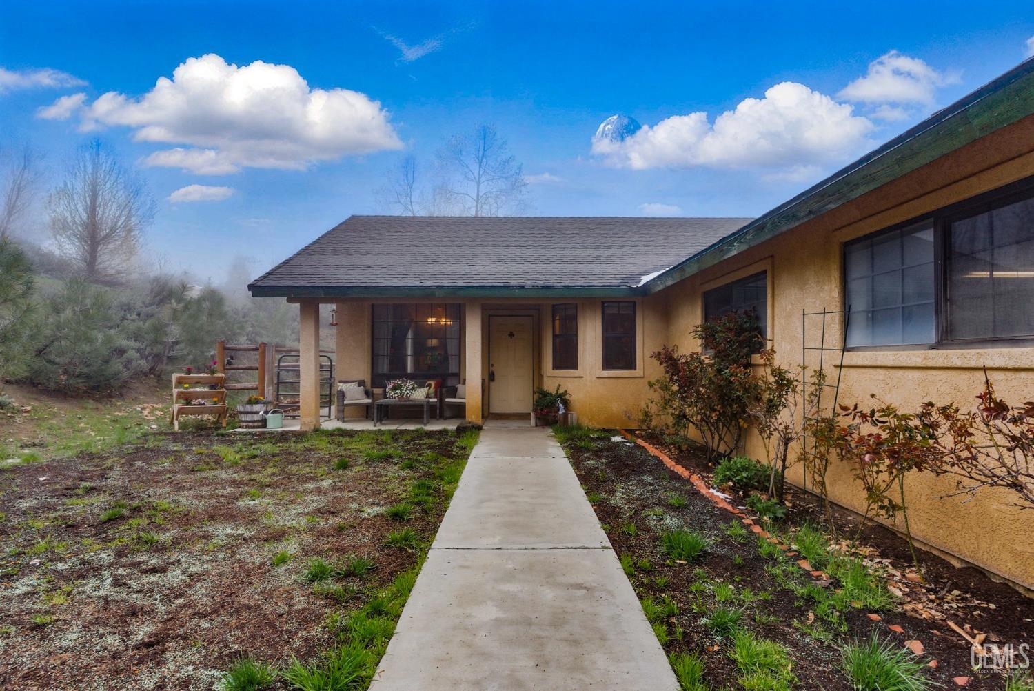 Undisclosed Address Tehachapi, CA 93561 - Photo 37 of 40 a front view of a house with garden