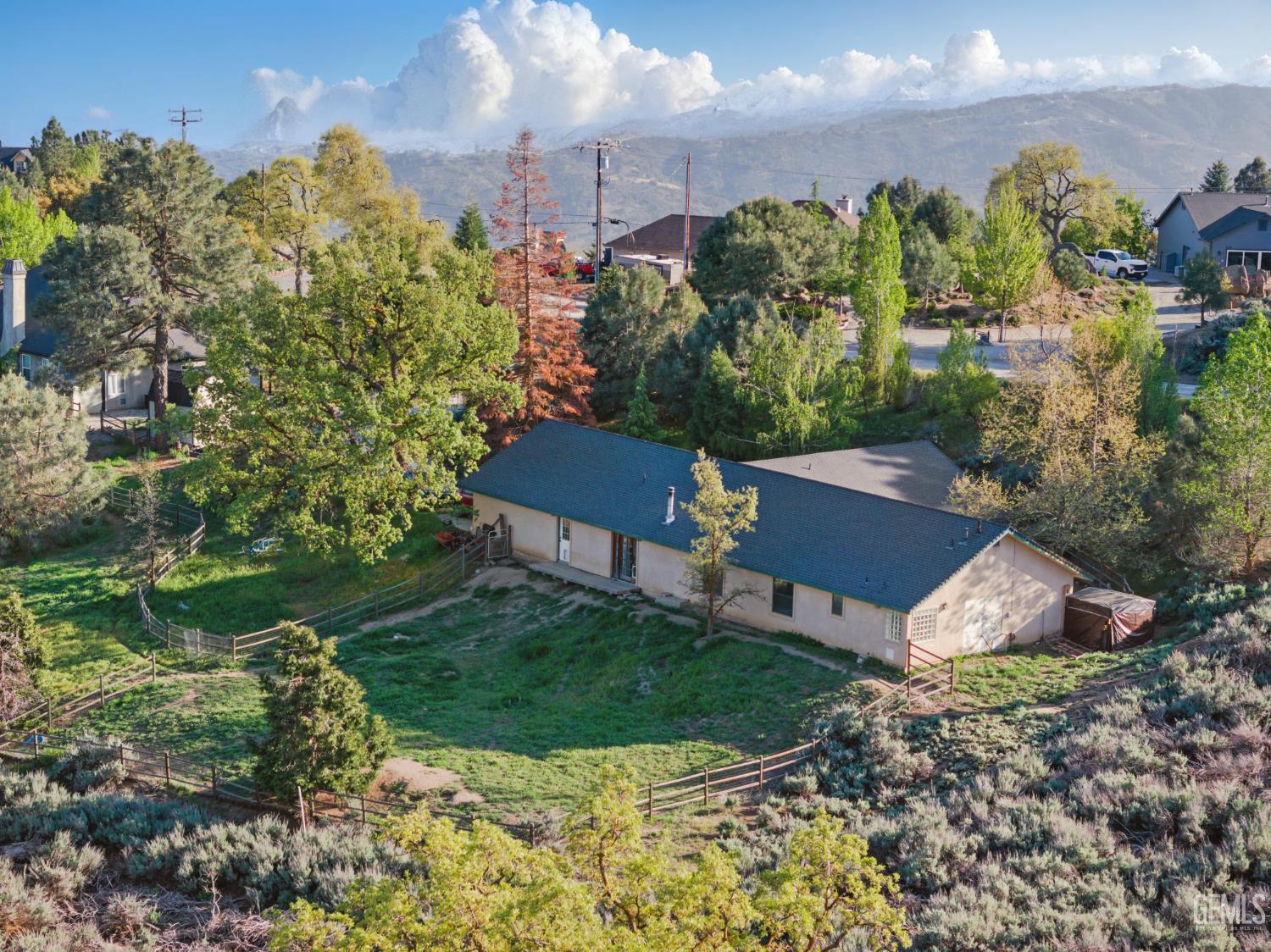 Undisclosed Address Tehachapi, CA 93561 - Photo 6 of 40 a view of a house with a yard and potted plants
