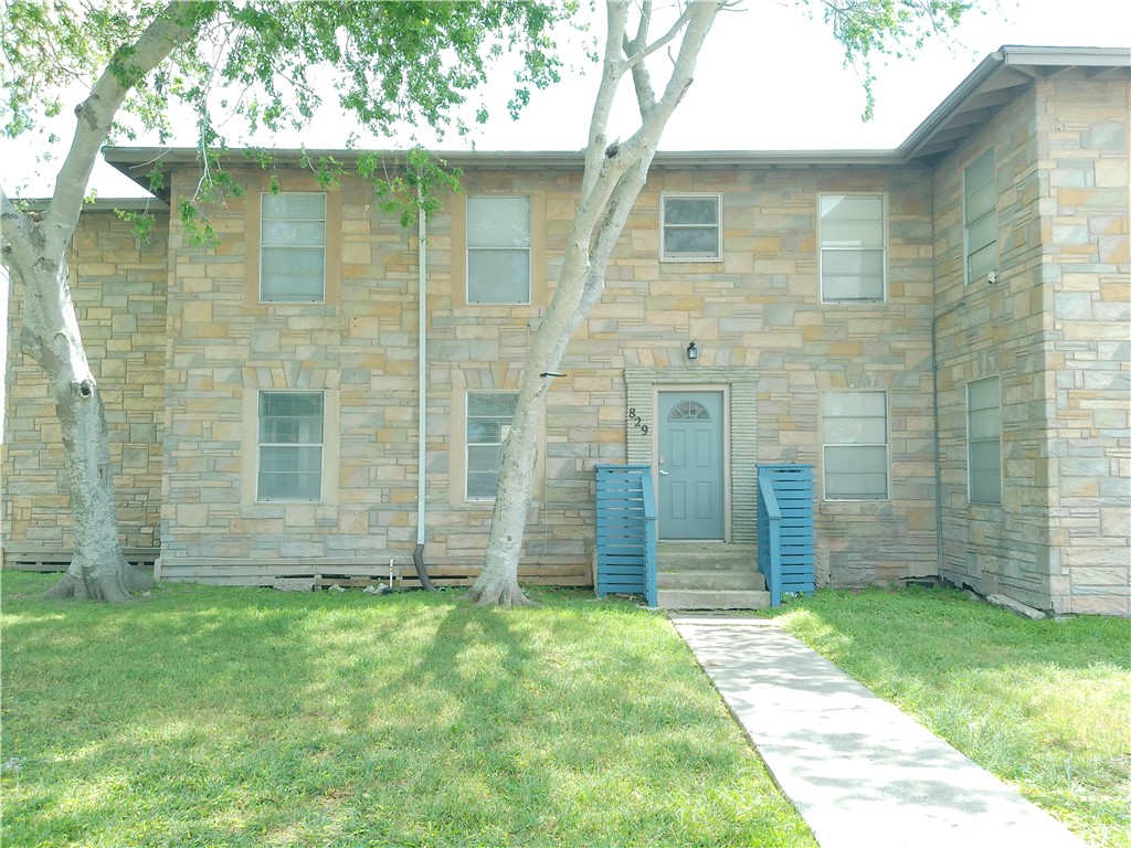 829 Indiana Avenue, Unit 2 Corpus Christi, TX 78404 - Photo 1 of 12 front view of a brick house with a yard