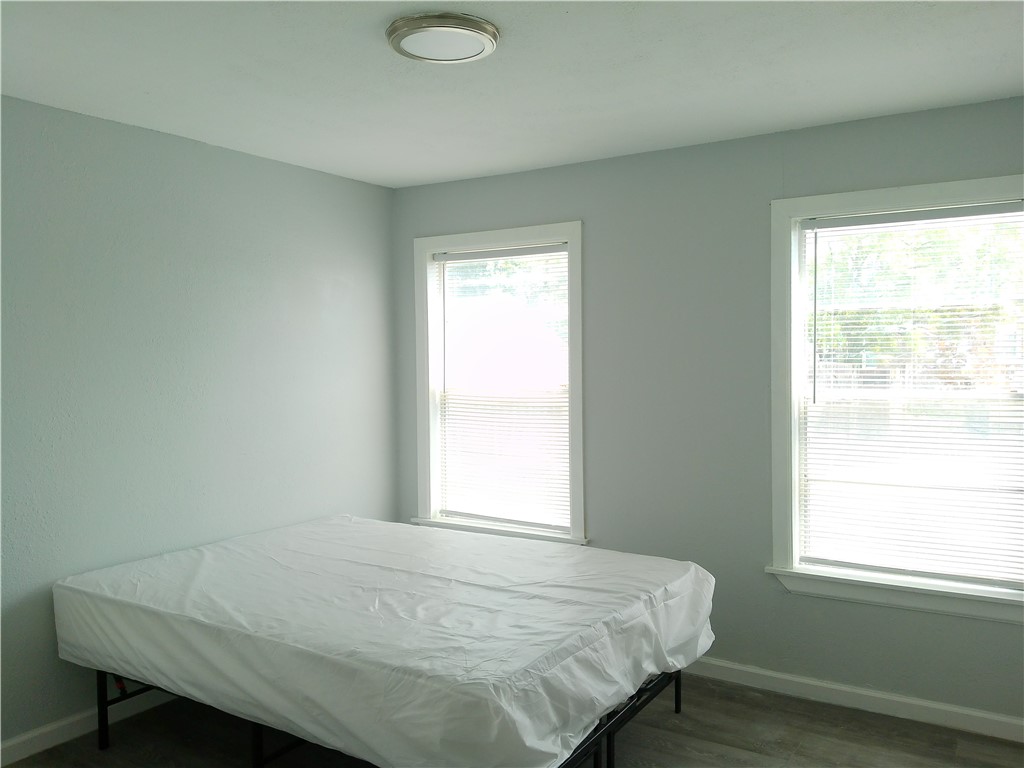 829 Indiana Avenue, Unit 2 Corpus Christi, TX 78404 - Photo 11 of 12 a bedroom with a bed and a window