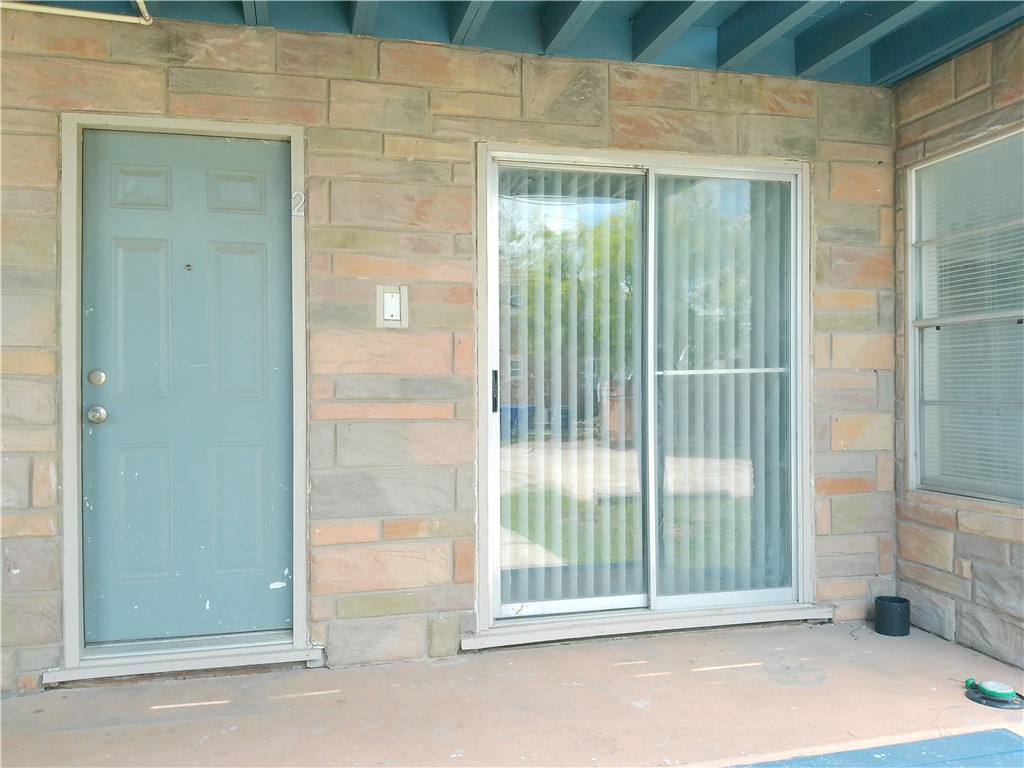 829 Indiana Avenue, Unit 2 Corpus Christi, TX 78404 - Photo 3 of 12 a view of a room that has a large window