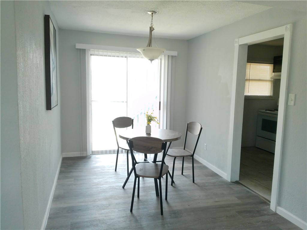 829 Indiana Avenue, Unit 2 Corpus Christi, TX 78404 - Photo 7 of 12 a dining room with furniture and window
