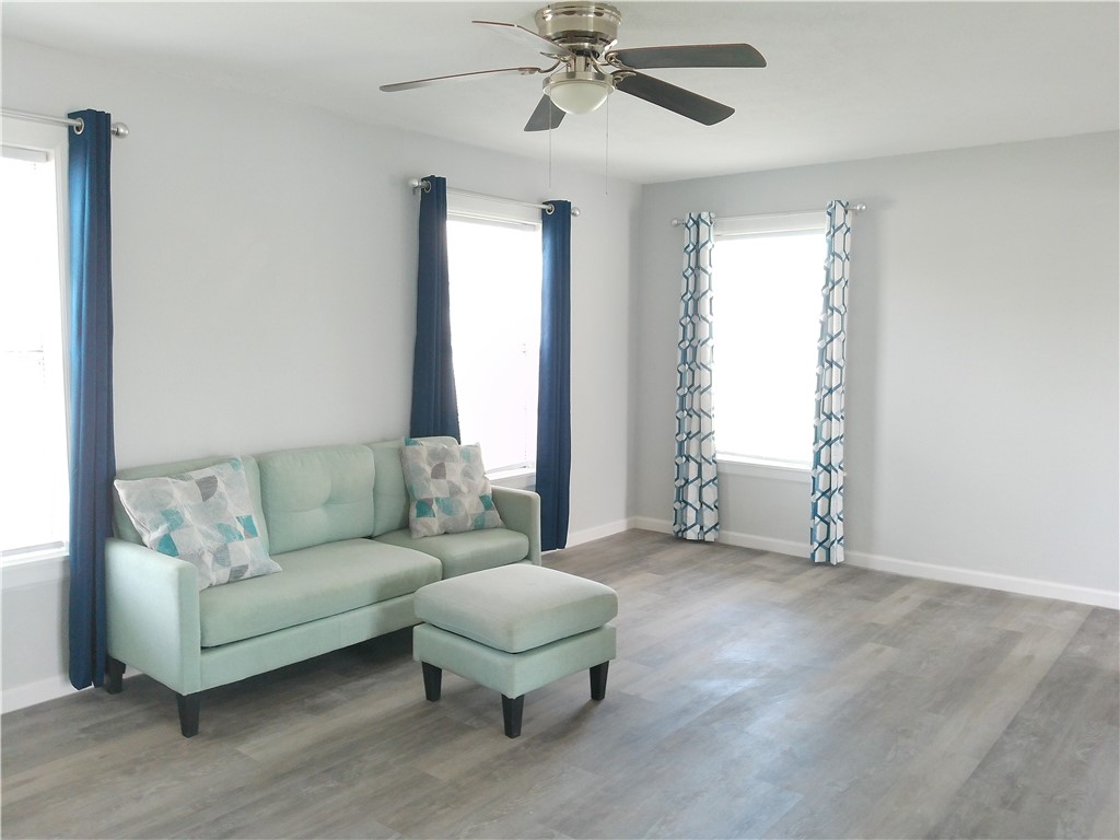 829 Indiana Avenue, Unit 2 Corpus Christi, TX 78404 - Photo 8 of 12 a living room with furniture and a window