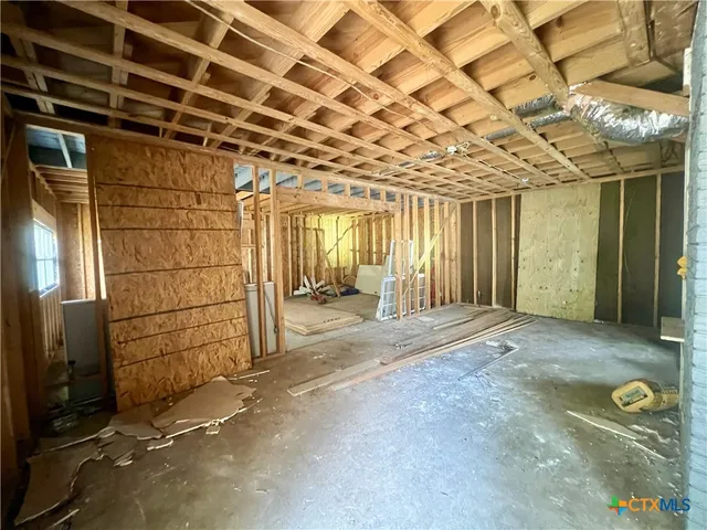 a view of a room with wooden walls