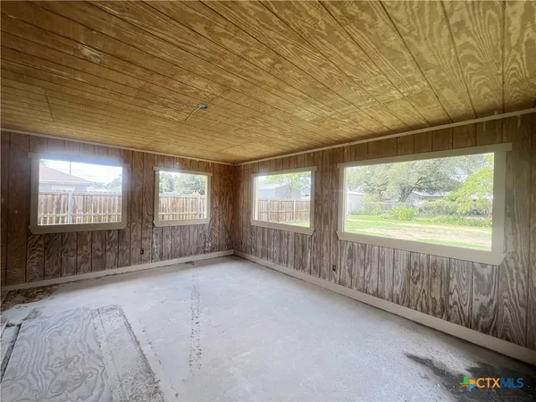 an empty room with windows