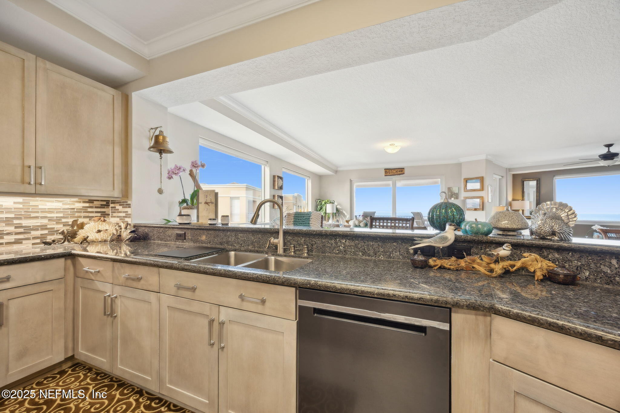 60 Surfview Drive, Unit 801 Palm Coast, FL 32137 - Photo 13 of 64 a kitchen with a sink dishwasher and cabinets