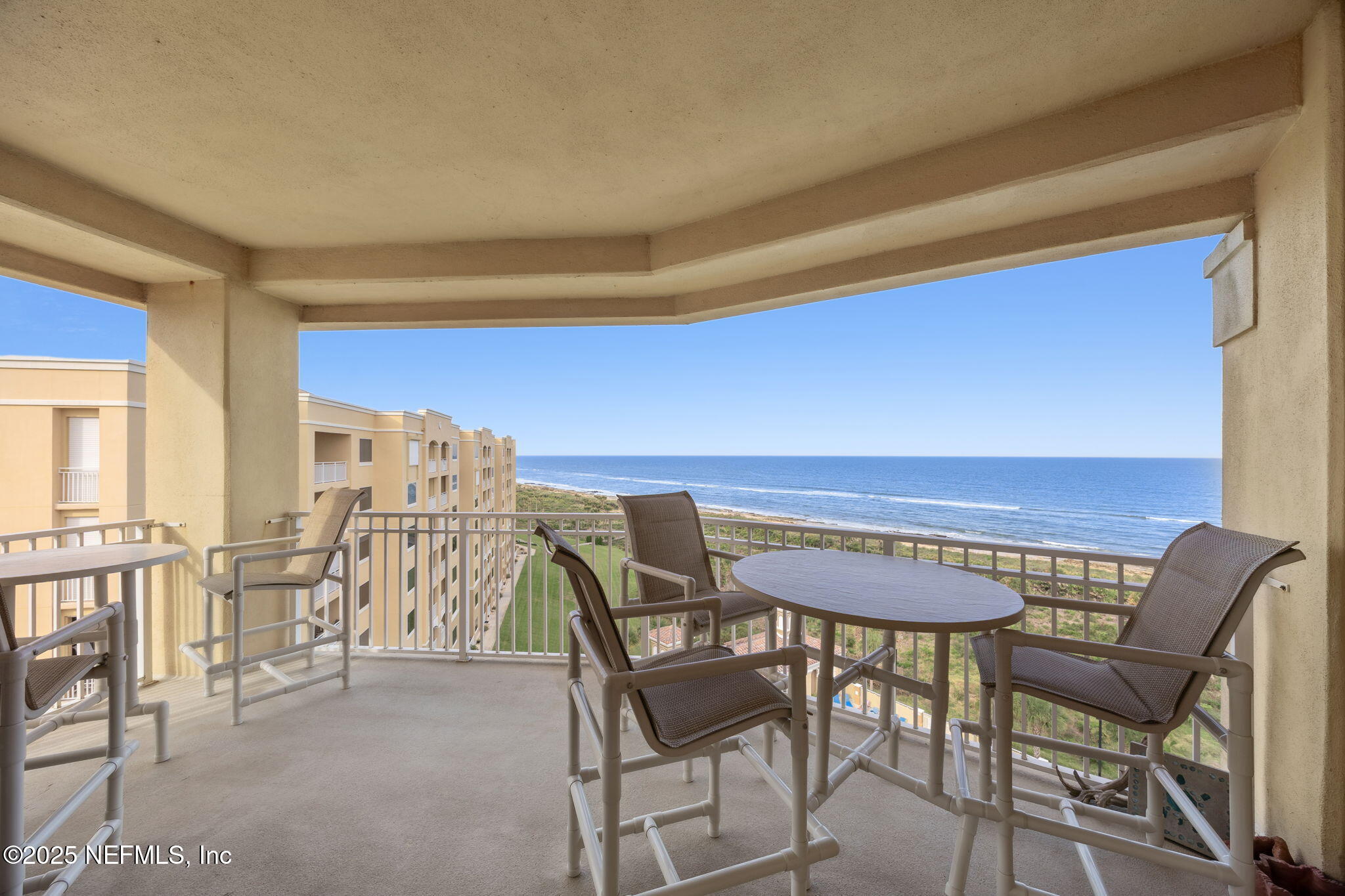 60 Surfview Drive, Unit 801 Palm Coast, FL 32137 - Photo 20 of 64 a view of a dining room with furniture and chandelier