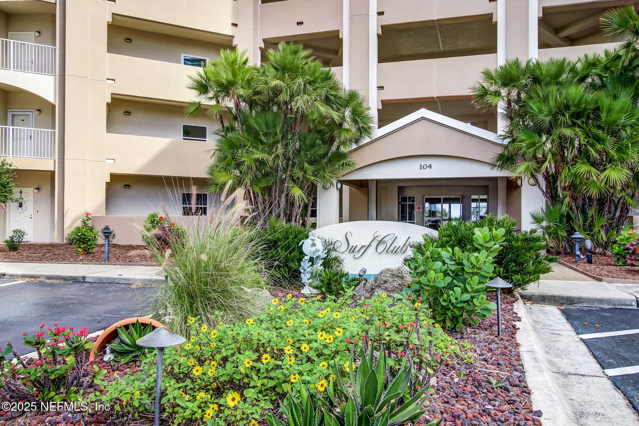 60 Surfview Drive, Unit 801 Palm Coast, FL 32137 - Photo 2 of 64 a front view of a house with a yard