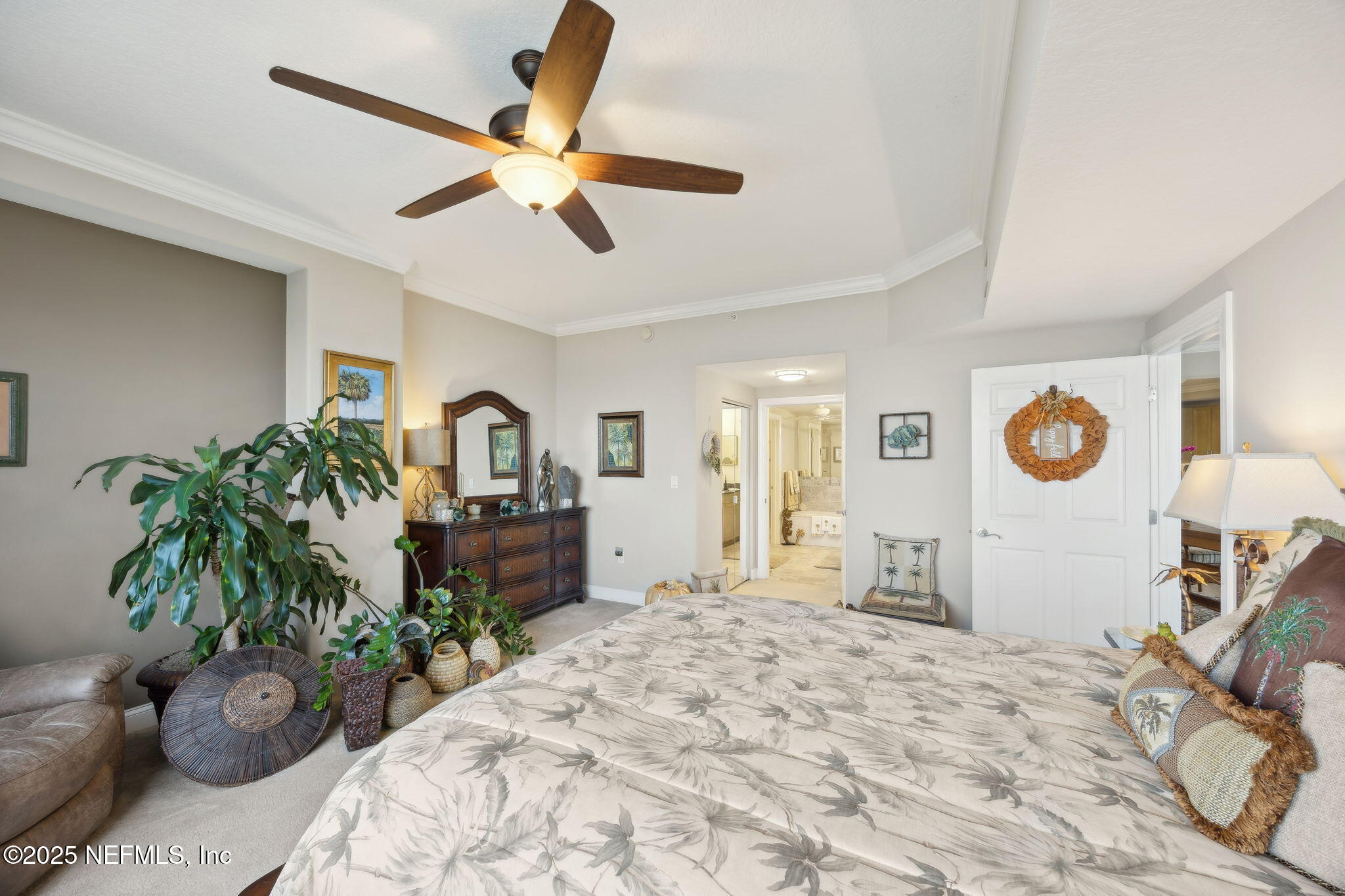 60 Surfview Drive, Unit 801 Palm Coast, FL 32137 - Photo 24 of 64 a living room with furniture and a potted plant