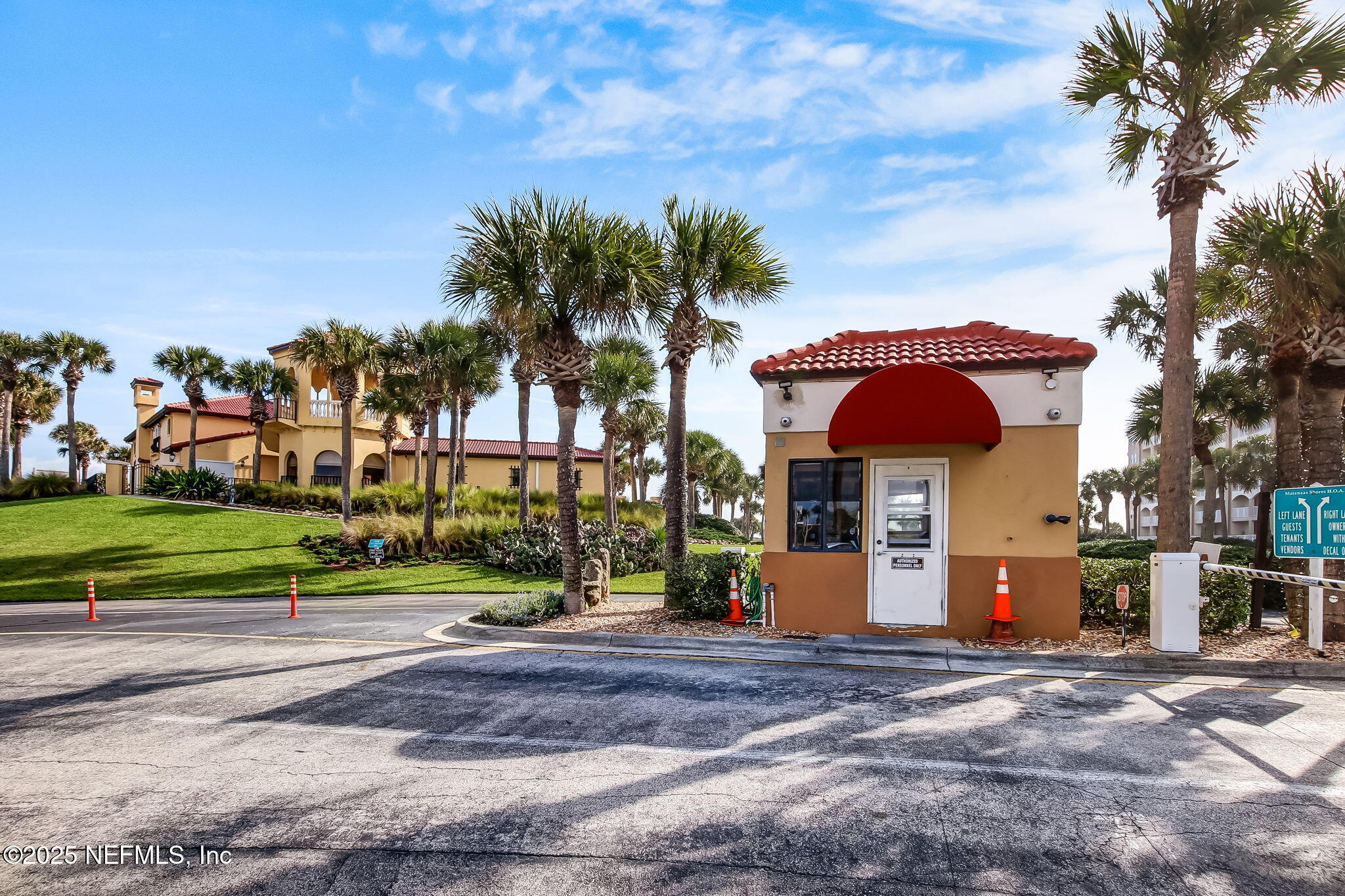 60 Surfview Drive, Unit 801 Palm Coast, FL 32137 - Photo 31 of 64 a front view of a house with a yard and palm trees