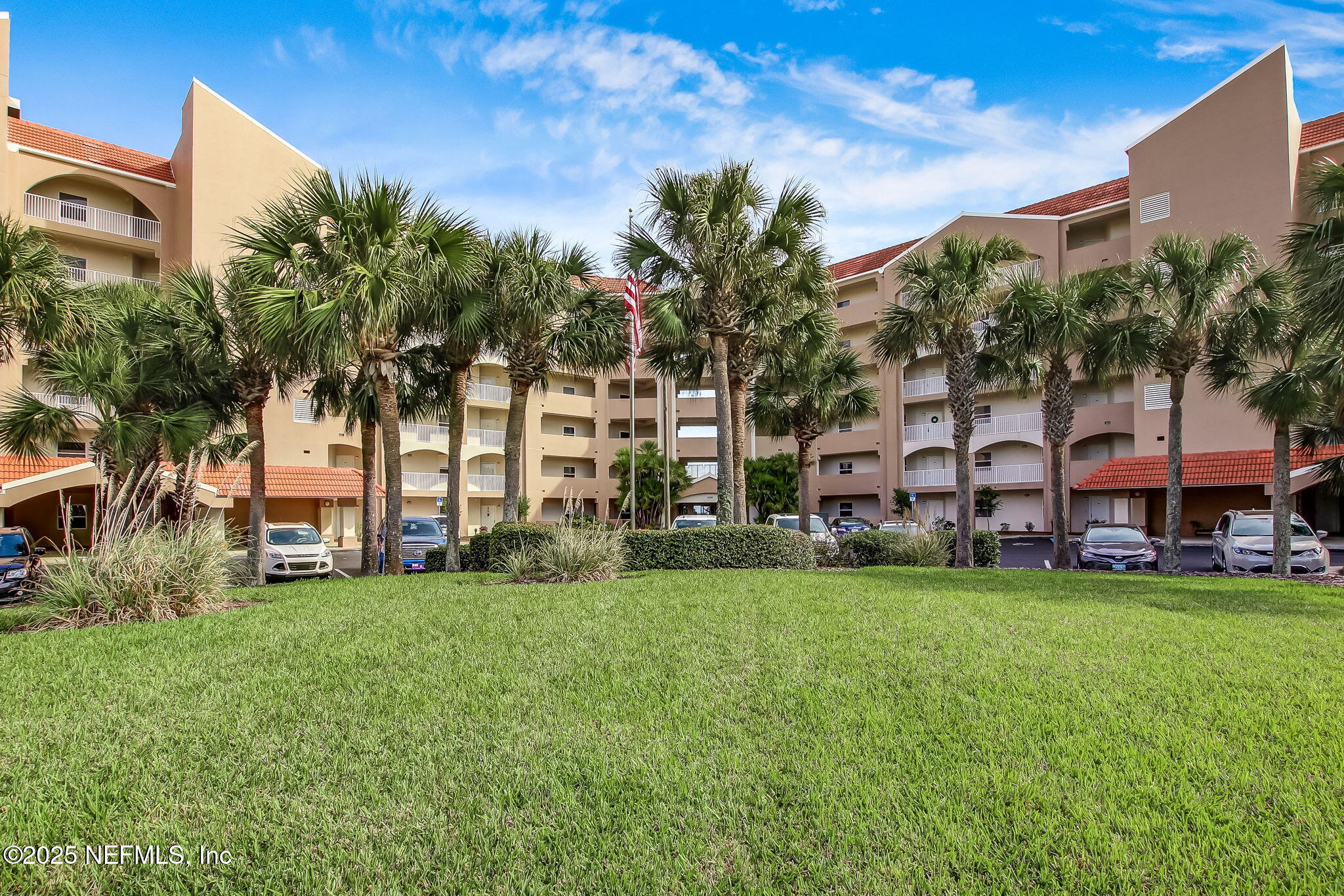 60 Surfview Drive, Unit 801 Palm Coast, FL 32137 - Photo 33 of 64 a view of a building with a yard