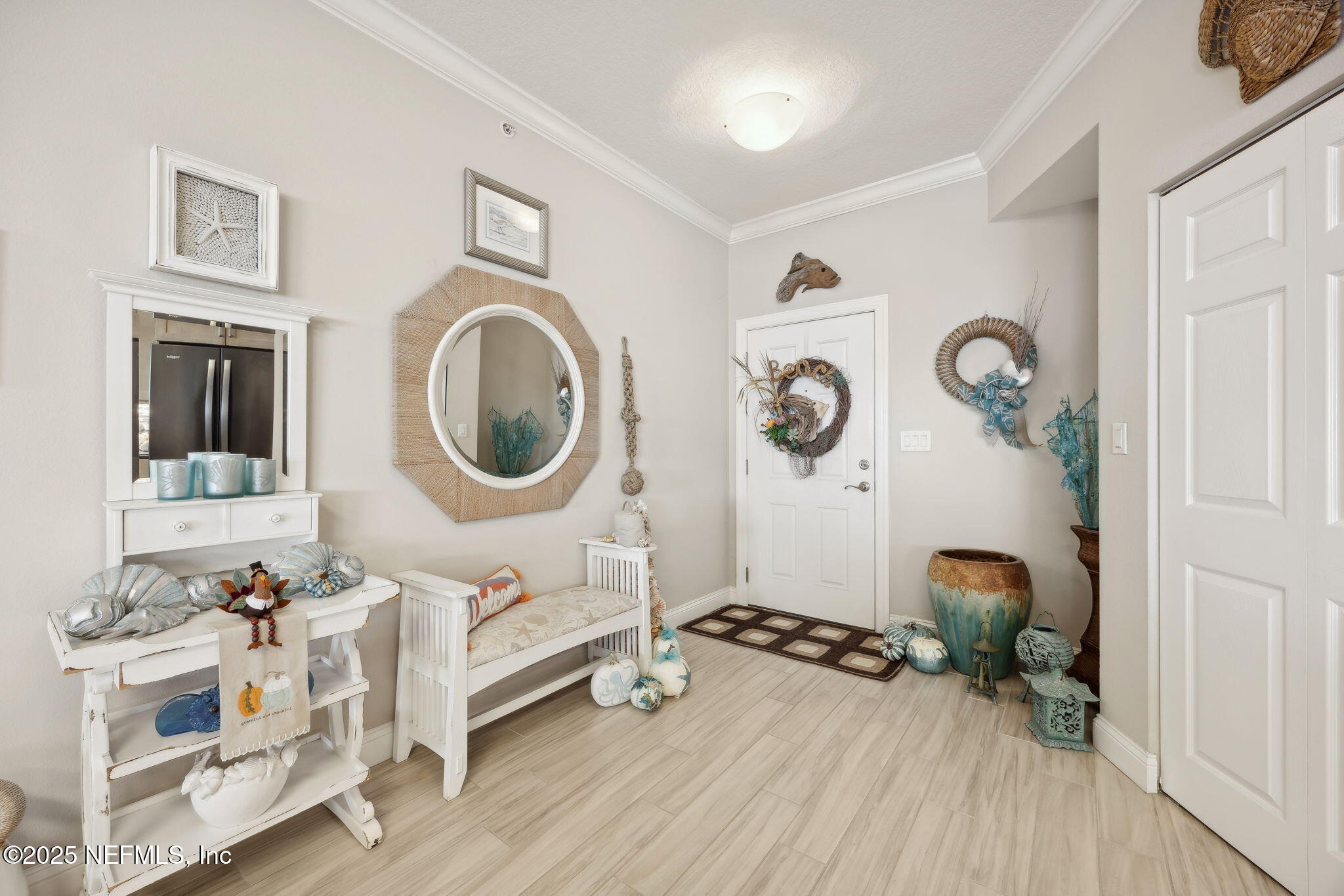 60 Surfview Drive, Unit 801 Palm Coast, FL 32137 - Photo 5 of 64 a room with furniture and a mirror