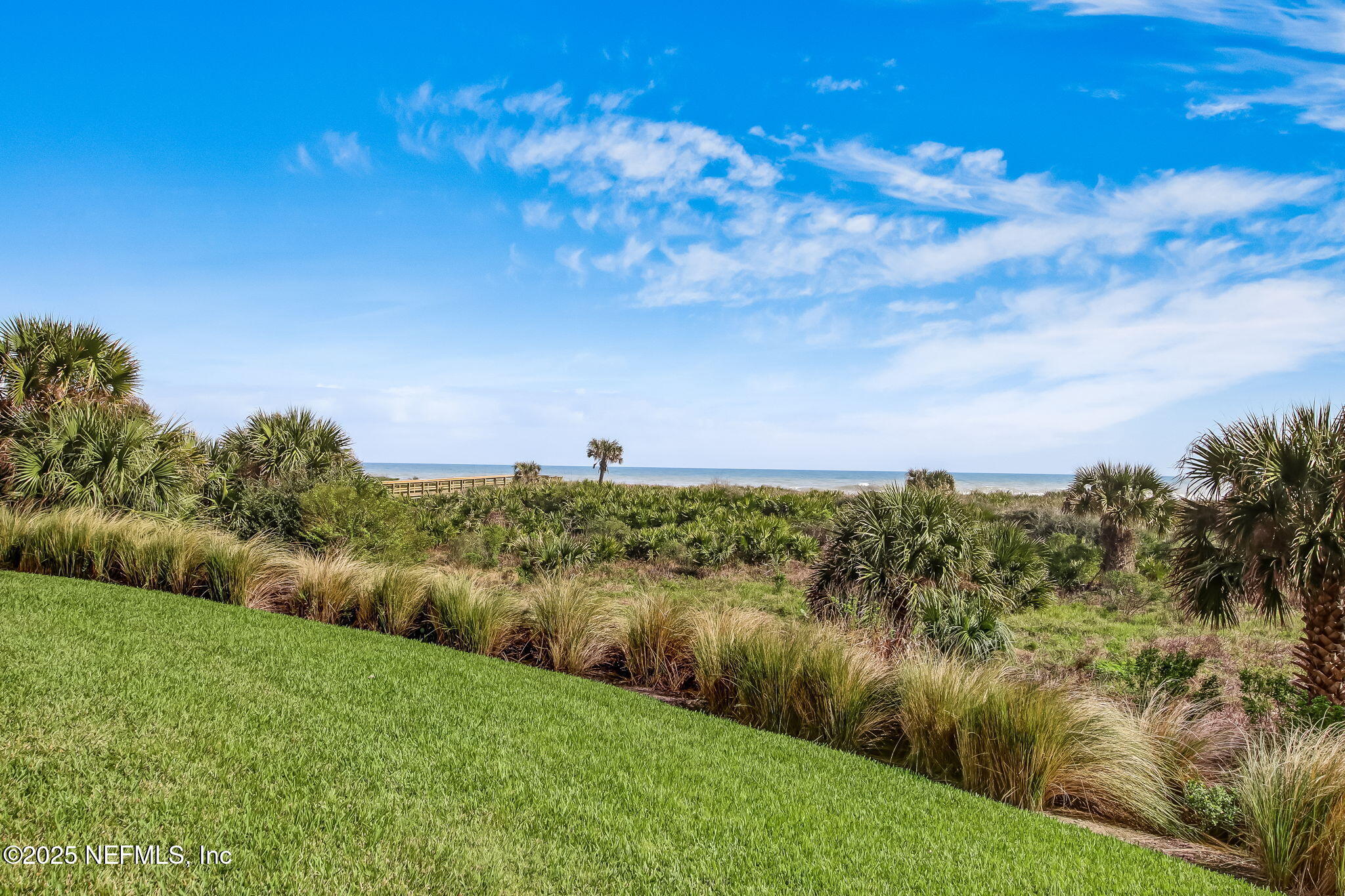 60 Surfview Drive, Unit 801 Palm Coast, FL 32137 - Photo 54 of 64 a view of a lake with a yard
