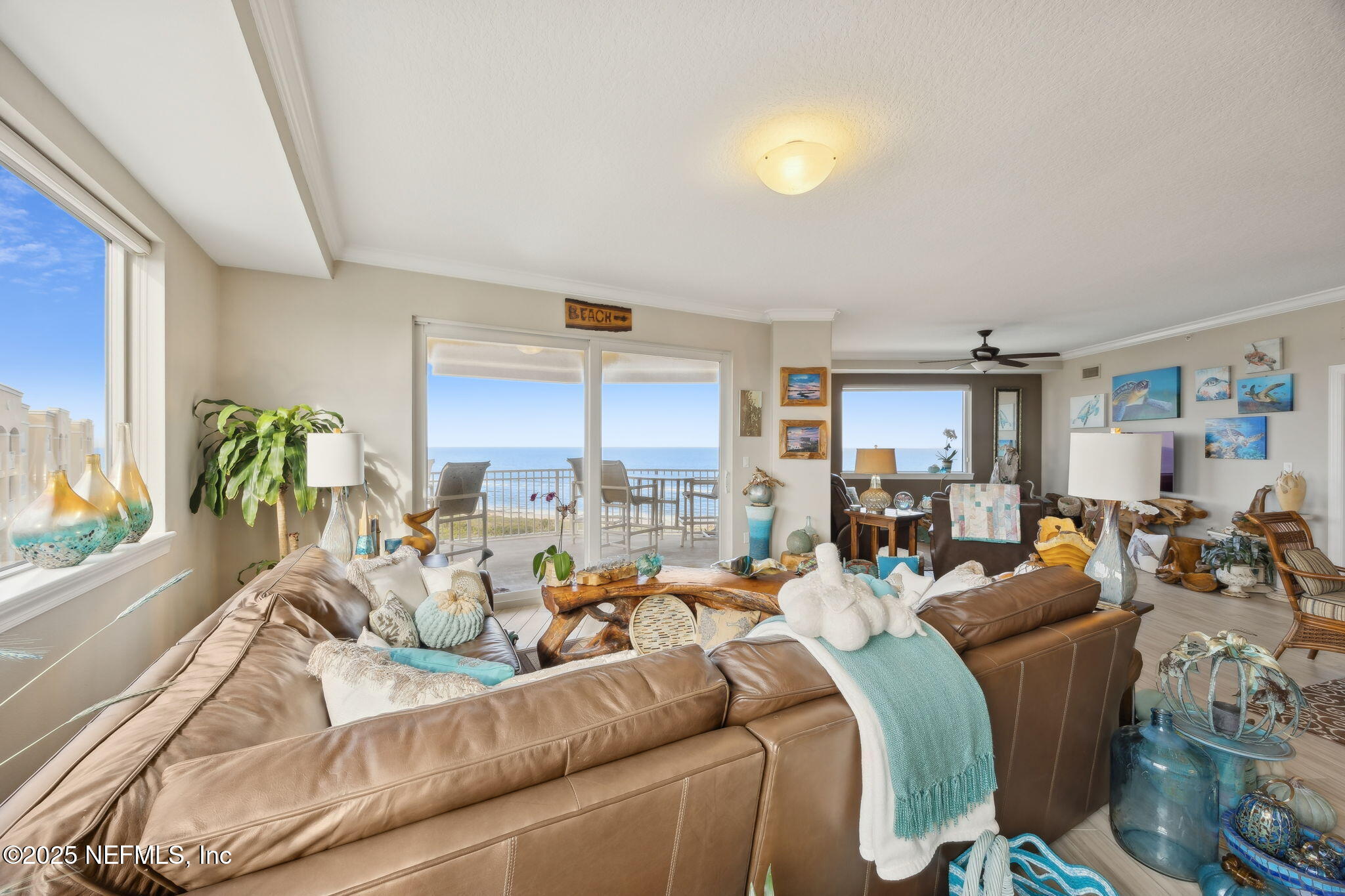 60 Surfview Drive, Unit 801 Palm Coast, FL 32137 - Photo 6 of 64 a living room with furniture and a large window