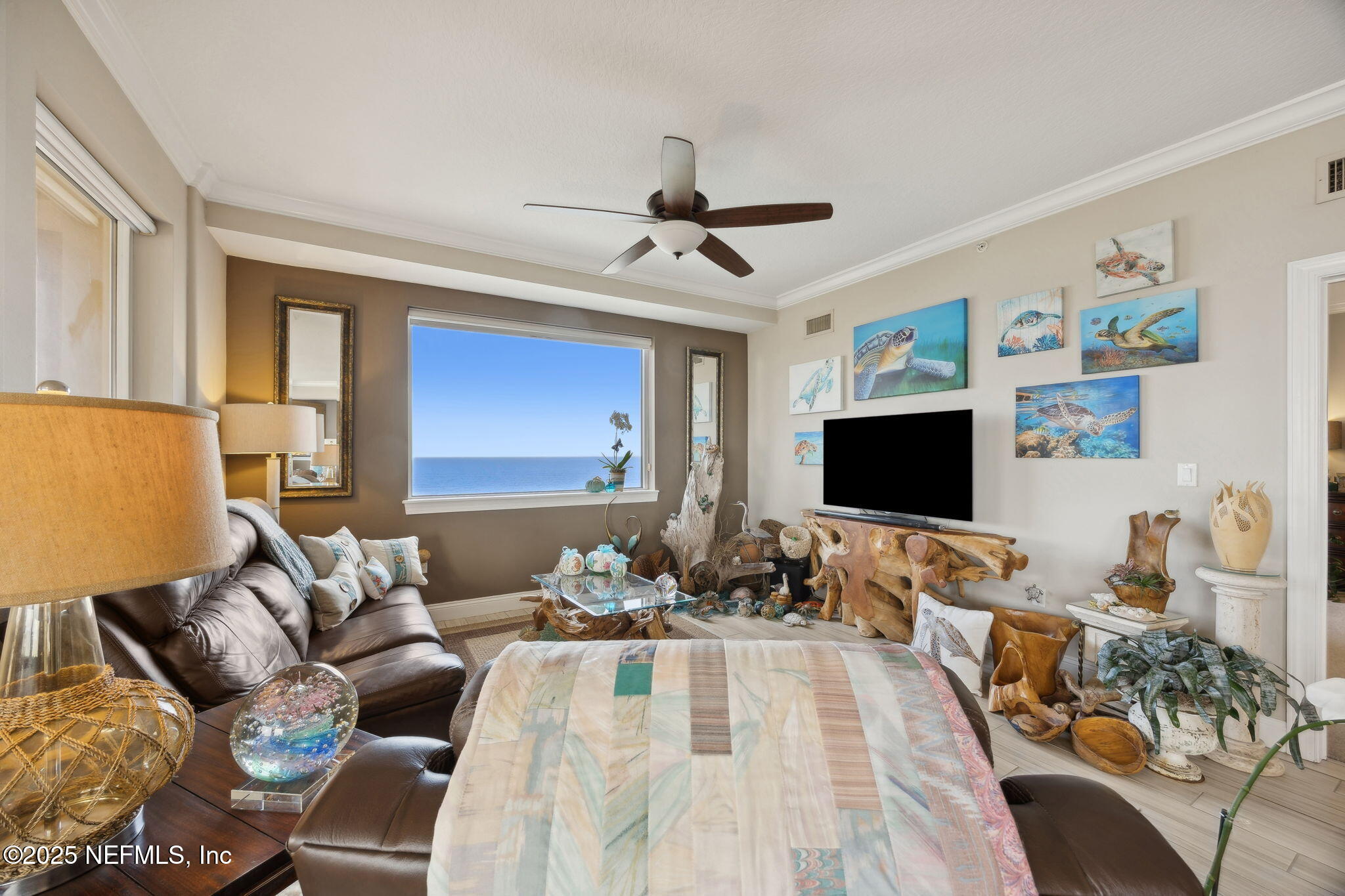 60 Surfview Drive, Unit 801 Palm Coast, FL 32137 - Photo 9 of 64 a living room with furniture and a flat screen tv
