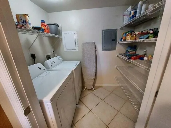 a utility room with dryer and washer